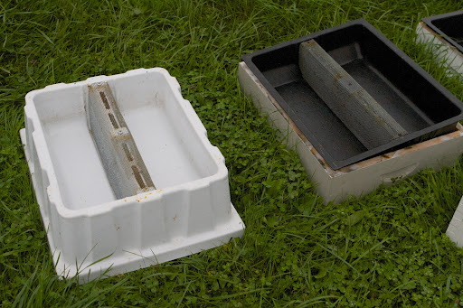 The next step with the hives was to put these hive top feeders in place, which are used to offer sugar syrup to the bees when the nectar flow is minimal or nonexistent.