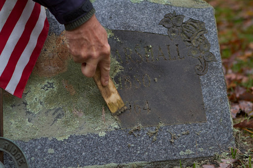 The lichen comes right off the surface and then the letters can be picked clean. It's important to use forgiving tools that won't scratch or damage the stone in any way.