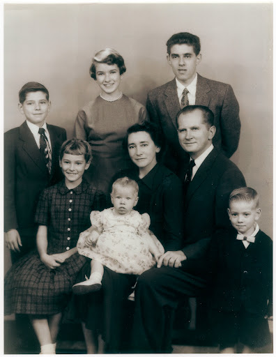 This family portrait with me back row center, was taken 56 years ago.