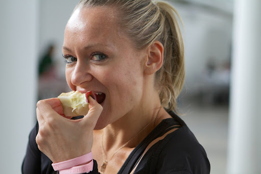 Fitness guru and personal trainer, Simone, is the owner of Body by Simone. Her gym specializes in dance fitness, which focuses on shaping the long lean muscles to create the signature dancer's physique. Here she is enjoying an apple from my farm. http://bodybysimone.com/