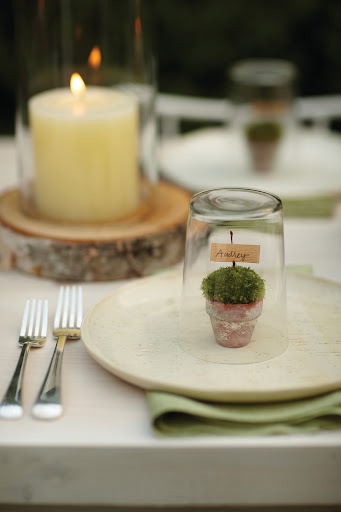 Our Good Things section gives great ideas for bringing spring to the table, like this place card, made from a little pot of moss….