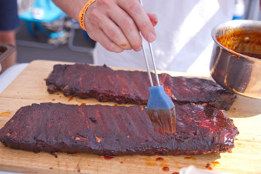 About 30 minutes before the ribs had finished cooking, Gregg applied the sauce and put them back into the smoker for finish.