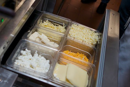 For convenience and speed, all of the crêpe fillings are kept in refrigerated drawers right beneath the crêpe makers. This is the cheese drawer.