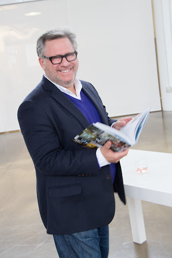 Bruce Glickman, owner of the furniture gallery Duane in New York City, flipped through his new copy of Designers at Home.