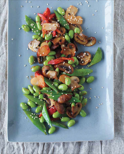 Warm Edamame Salad gets a lot of interesting textures from water chestnuts, mushrooms, and snap peas, and spicy flavors by way of fresh ginger and hot chile sauce. Serve this terrific salad with brown rice or soba noodles.