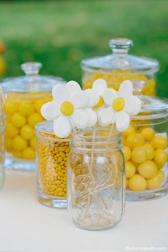 Mason jars and other glass candy dishes lined the candy and favor table.