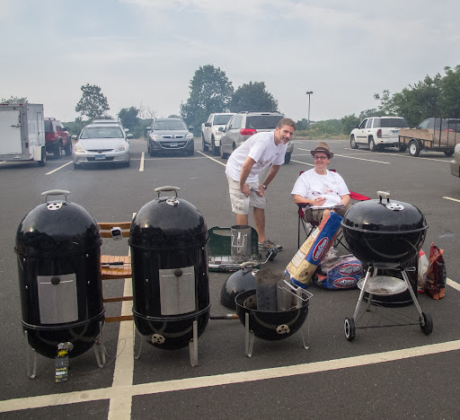 After getting the coals lit, Scott and Gregg waited for the Kansas City Barbecue Society (KCBS) representatives to inspect their meat so they could start prepping and cooking.
