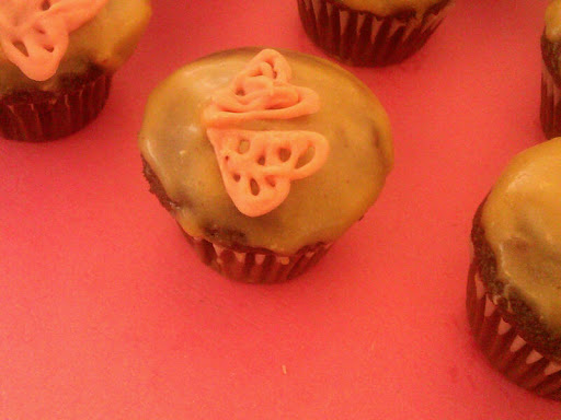 Cari Wolfert baked some chocolate cupcakes with peanut butter icing just because they're 'better together' :) Melted pink candy piped into hearts adorn the tops of these cute treats.
