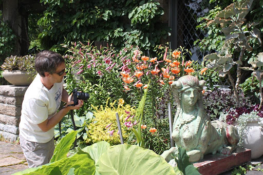 Tim taking a photo of one of the sphinx statues that guards the living room entrance.
