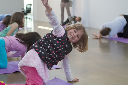 Harper, daughter of Video Director of Design Anduin Havens gets in a nice stretch, getting ready to take on all the great poses Sophie would lead them into