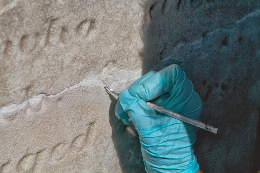 She also has precision tools for the detail work of sculpting letters and numbers back in. Restoration is an art and Lisa is very good at her craft.