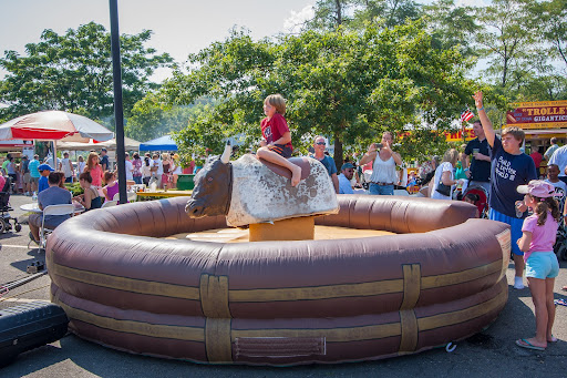 There were plenty of activities for kids. Here a kid tried to stay on the mock bull. He fell off a couple seconds after this photo was taken.