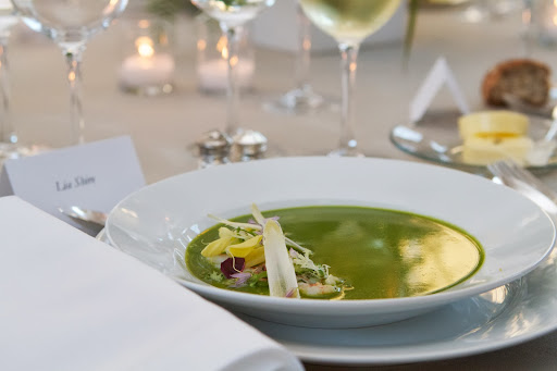 Waiters then ladled a delicious asparagus soup over it, delicately flavored with lemon and tarragon.