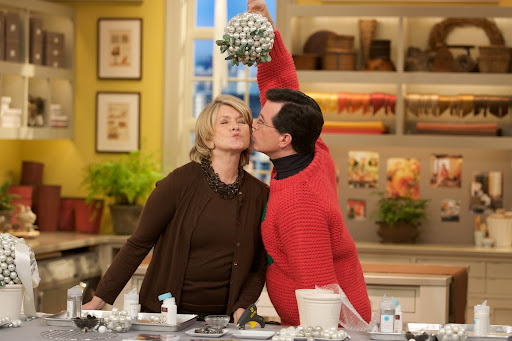 I taught Stephen Colbert, clad in his festive Christmas sweater, how to craft a mistletoe kissing ball. Clearly, he wasn't afraid to use it!
