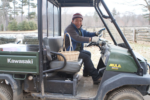 With his daily chicken chores complete, Phurba heads to the house to deliver the freshly laid eggs.