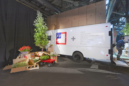 The event had large trucks surrounding the space with flowers and other plants to recreate the