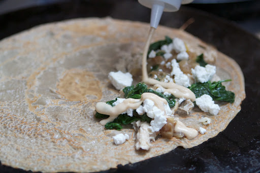 It also gets sauteed onions, goat cheese, and a bechamel sauce.
