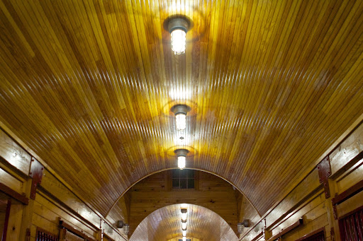 The barn has an impressive arched ceiling.