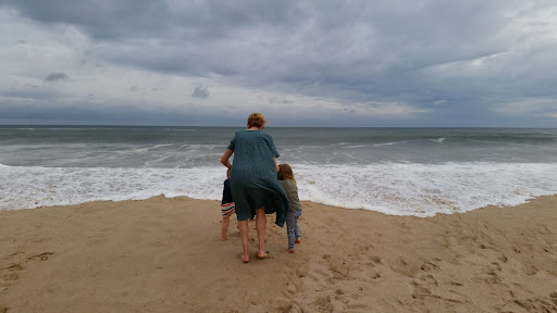 The kids wanted to run into the water but were apprehensive because of the noise and thunder of the breaking surf.
