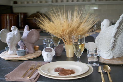 This is a purely decorative embellishment. These plates should be replaced with heated dinner plates for the meal.
