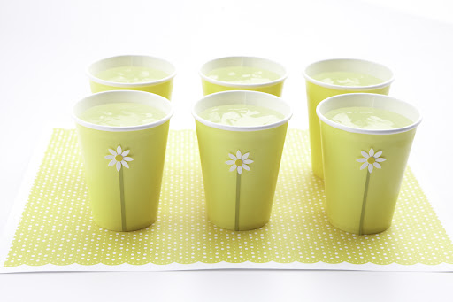 If not opting for mason jars, it's easy to add simple details, like craft stickers, to solid color paper cups.