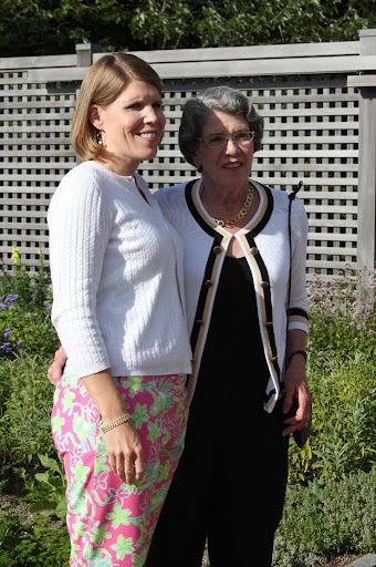 Elizabeth Johnson posing with her mother, Becky, in the cutting garden