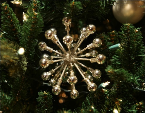 The sparkling satellite ornaments are made with foam balls, toothpicks, silver beads, and silver glitter.