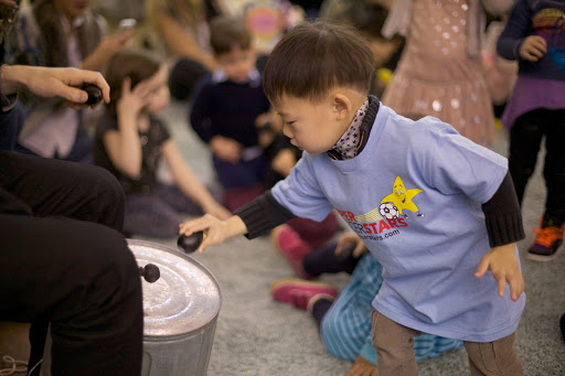 Timbalooloo http://www.oranetkin.com/kids.htm uses stories, games, songs, and movement to introduce kids to the fundamentals of music.