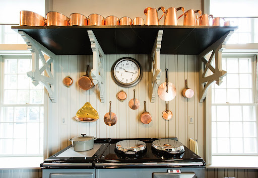 The stove is an Aga Cooker, a heat storage stove and cooker. When this unit is turned on, the low-intensity but continuously-burning source makes the kitchen a cozy place to be.