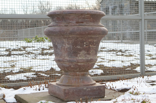 I am the proud owner of two very large Kenneth Lynch cast stone planters. Several years ago, one of them cracked during winter. I had it successfully repaired and since then, I'm insistent that they are well-protected from harsh winter elements.