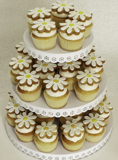 Or you can decorate them with frosted sugar cookies, like these daisy cookies from Eleni's. http://elenis.com/