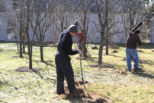 And also giving the lawn areas a good raking, removing dead grass and other debris. If you've ever wondered where these hard-working fellows keep all the farm tools and equipment, I'll give you a peek inside a very important building.