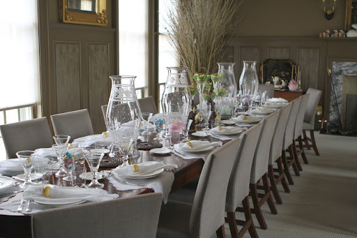 Easter dinner will be served in the brown dining room. The long table is in the process of being set and decorated. Unfortunately, the table isn't long enough to accommodate twenty-one people.