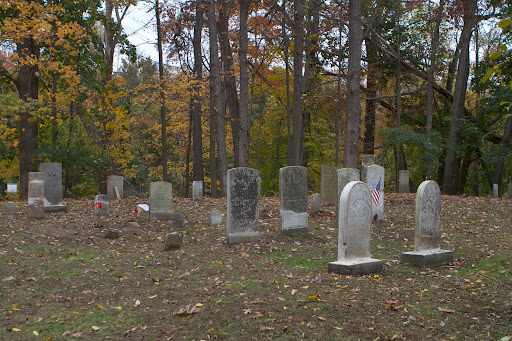 These headstones had all been toppled, buried, or tossed over the sides of the hill that this cemetery sits upon.