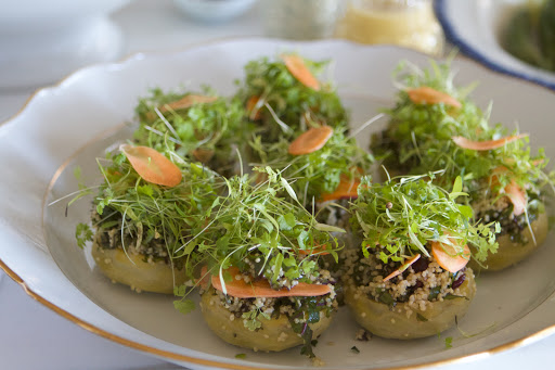 Artichoke hearts, pared of their leaves and cooked in flavored water until tender, were filled with quinoa, kale, and dried cranberry salad and topped with delicate micro-greens grown in my Urban Cultivator Residential model. http://www.urbancultivator.net/