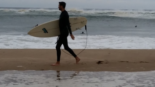 This surfer had enough. He was heading in and didn't seem to at all be phased by the chill in the air while being soaking wet.