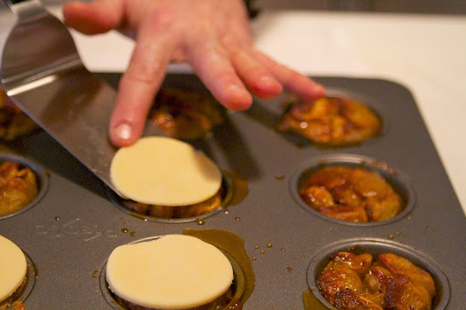 The pastry rounds were placed over the baked apples.