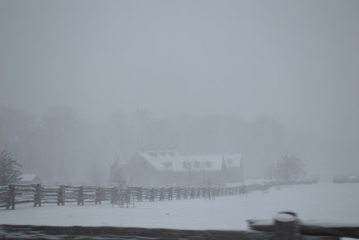The stone stable was barely visible through the thick falling snow.