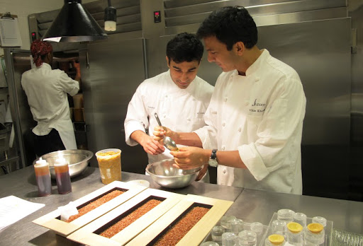 Chefs Vikas and Ali filling delicious chili crab salad cones.