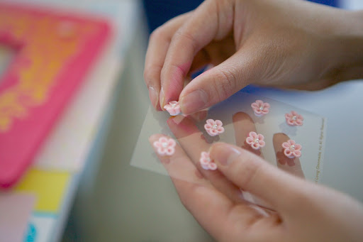 To further embellish her creation, Diana chose these fun Martha Stewart Crafts Mini Cherry Blossoms. You simply pull them off from the base sheet.