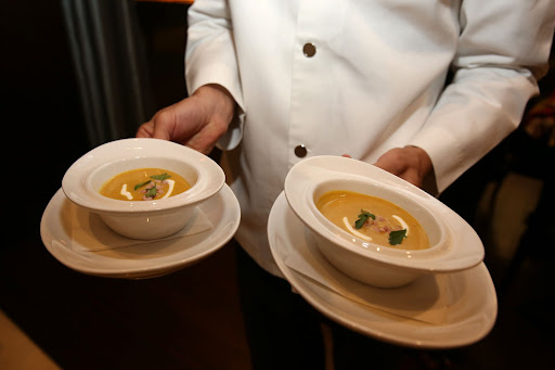Norman Van Aken presented a Caramelized Plantain Soup with Smokey Ham and Sour Cream. (Photo by Aaron Davidson/Getty Images)