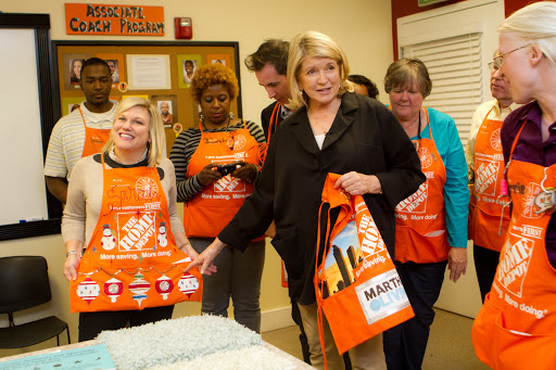 These associates were a crafty bunch! From left to right: Dewayne Kates, Sarah Fishburne, Javonda Grandison, Pam Burke, Richard McGriff, and Carrie Willoughby. Sarah is showing off an apron that Carrie decorated.