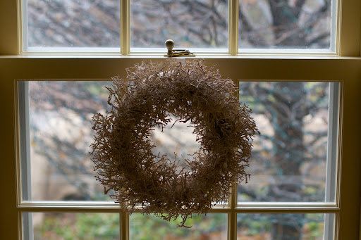 I like to hang decorative wreaths on interior windows, but I've always worried about marring the paint with hanging wires.