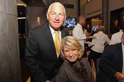 Here I am with Dean Mike Hampton, Chaplin School of Hospitality & Tourism Management for Florida International University. (Photo by Aaron Davidson/Getty Images)