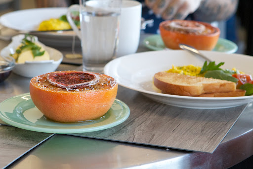 An elegant way to serve grapefruit is to loosen the segments from the membranes with a sharp knife and broil the grapefruit halves for a few minutes, then top each half with a candied blood orange slice. The recipe is on page 325 of my book, Martha's Entertaining.
