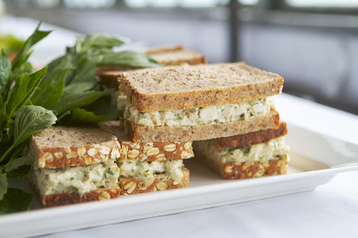 There were chicken salad sandwiches made with mustard and tarragon, and served on seven grain bread.