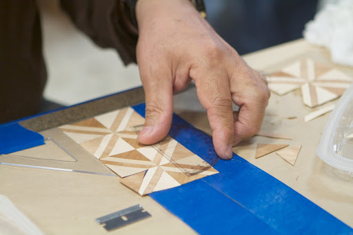 Designers use this versatile means of creative expression to decorate the smooth surfaces of pieces of furniture. Obviously, this art requires extreme precision.
