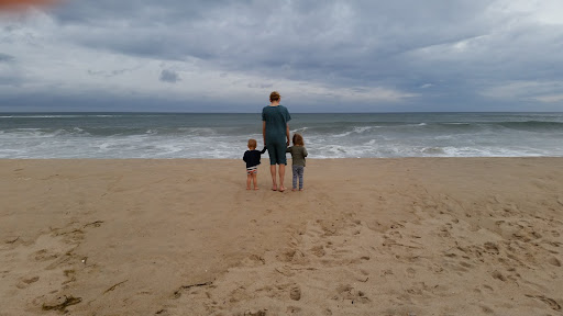 The children, Alexis and the angry East Hampton ocean, after the severe rain storm, which was a product of hurricane Arthur on July 4th.