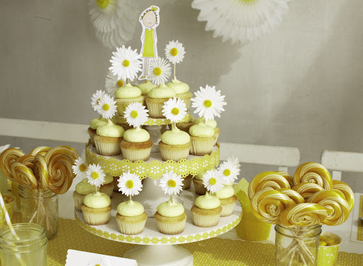 Darcy's illustration of her daughter adds a personal touch to the cupcake tower and Martha Stewart craft punches easily dress up a simple white cake stand.