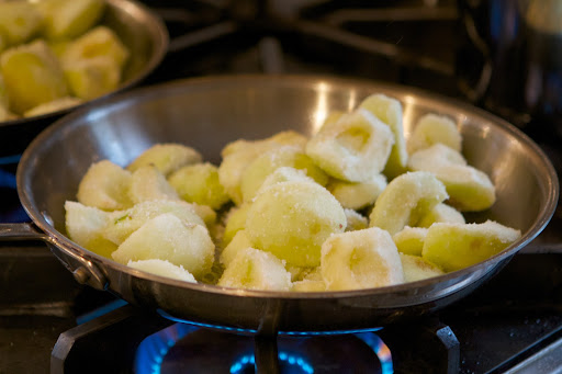 The apples, coated with sugar, were added to the melted butter.